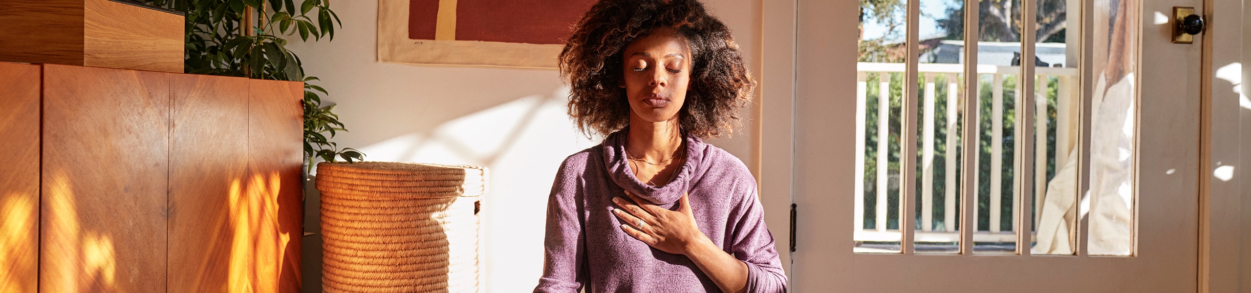 woman-eyes-closed-hand-over-chest