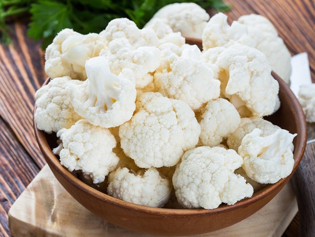 Cauliflower collected in a wood bowl