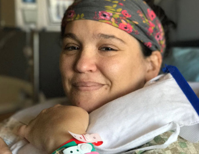 Irit Mandelsberg in a hospital bed after cancer treatment