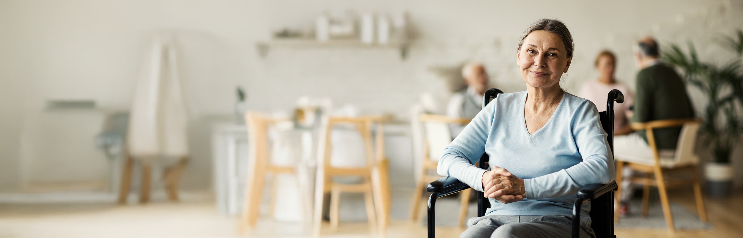 Woman in wheelchair smiling