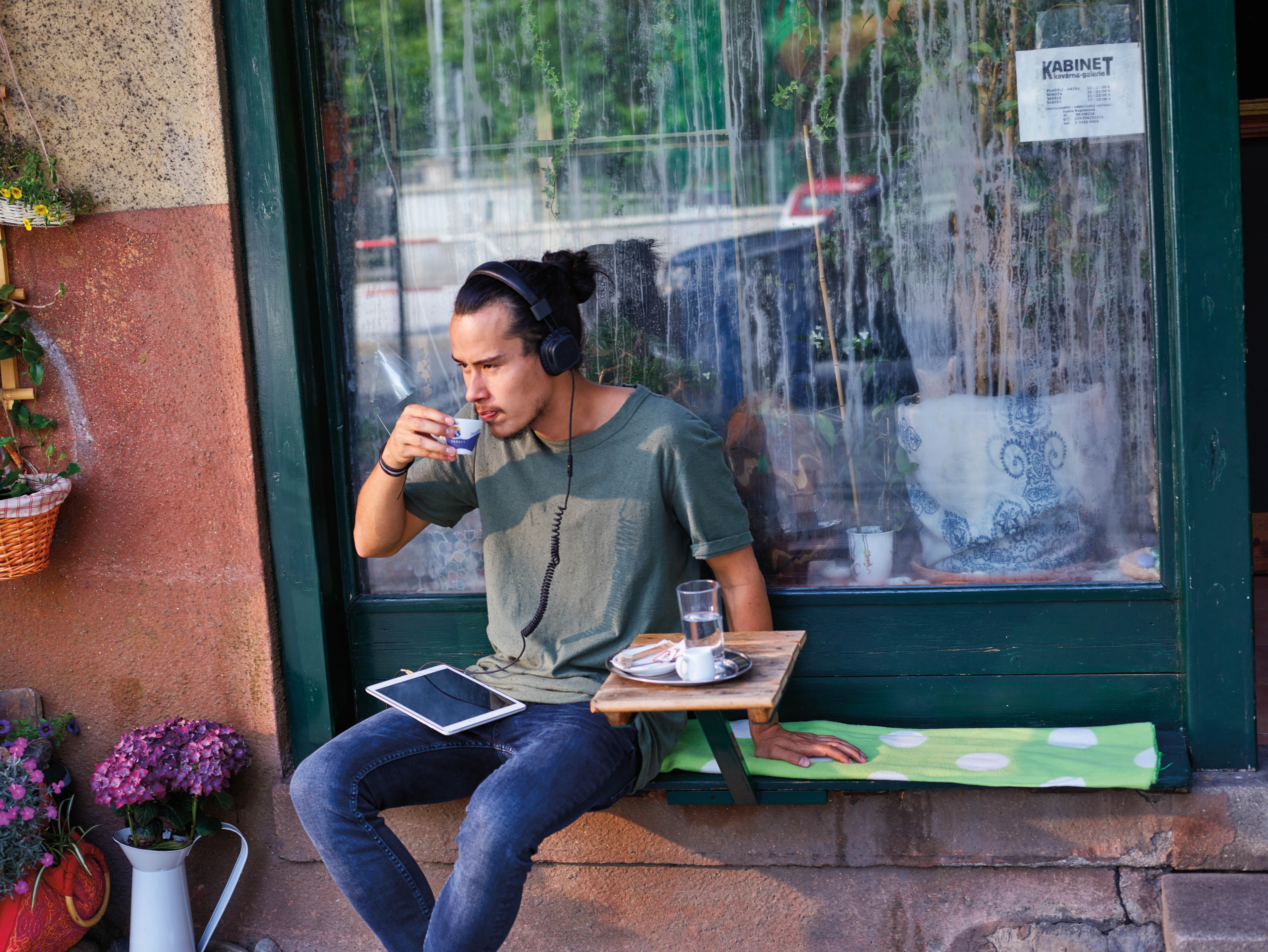 Millennial man outside coffee shop