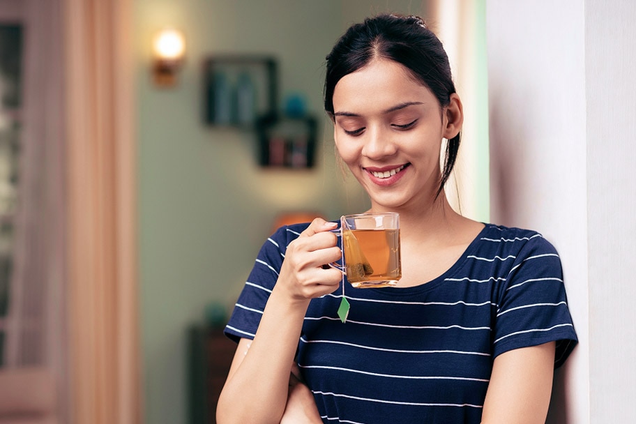 Person drinking tea at home