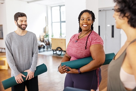 People talking before a yoga class