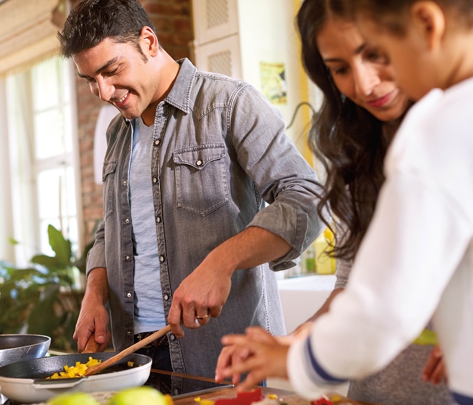 Family cooking a meal together