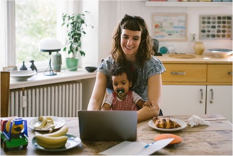 Parent and child using a laptop