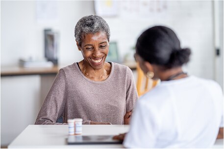 Smiling person with medication