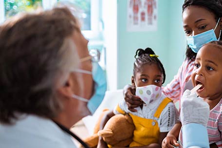 parent-and-children-visiting-a-doctor