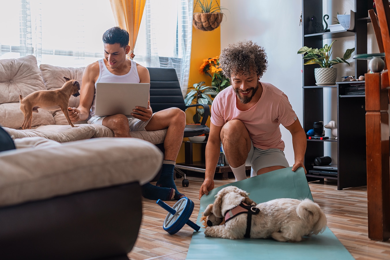  Couple exercising at home with pets