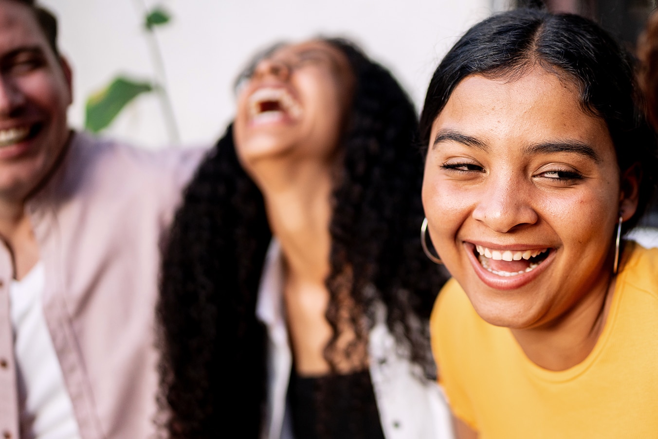 Three people laughing