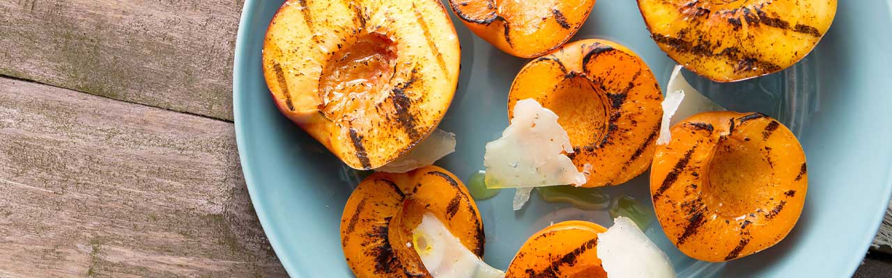 Plate of barbecue grilled peaches Plate of barbecue grilled peaches