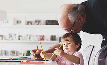 Photo of a man teaching a kid