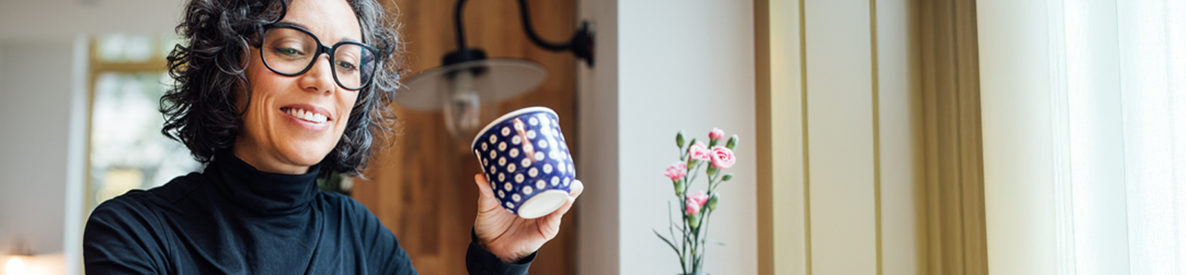 Person holding coffee cup