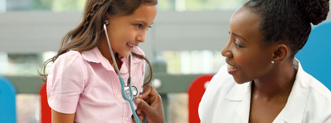 Photo of a little girl and doctor with a stethoscope Photo of a little girl and doctor with a stethoscope