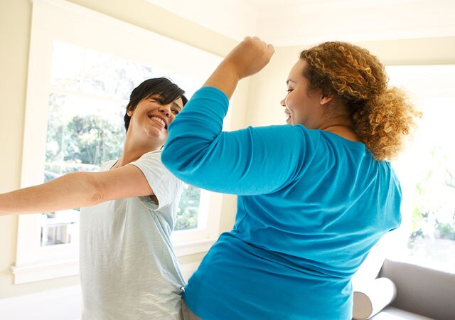Photo of two women dancing Photo of two women dancing