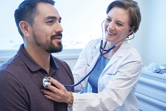 image of doctor providing care to patient