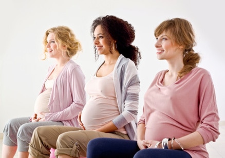 3 pregnant women sitting