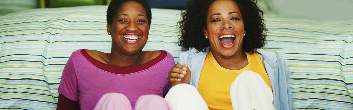 Couple watching tv and laughing together