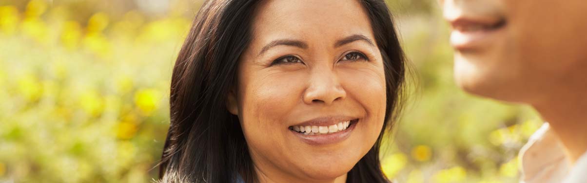 Woman looking at man and smiling