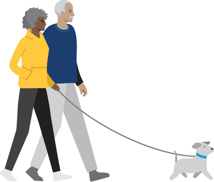 2 personas paseando el perro.